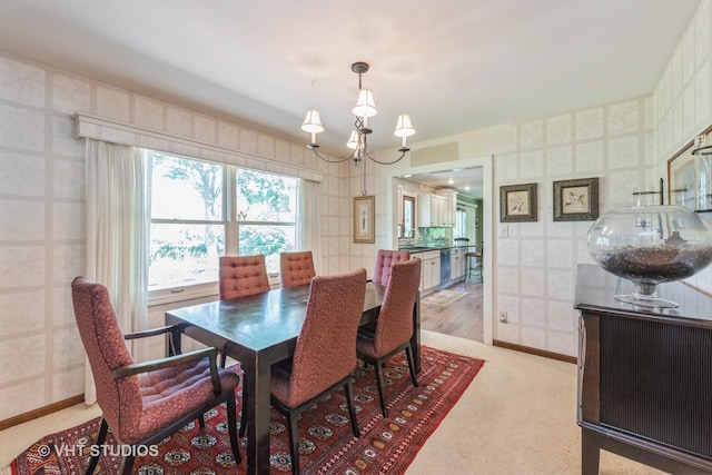 1954 Greenview St, Valparaiso, IN 46383 - dining room featuring wallpapered walls, a chandelier, and light colored carpet