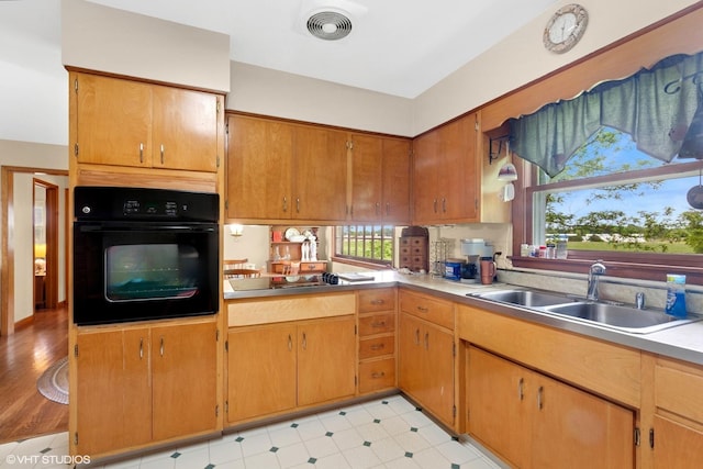 43W888 Hughes Rd, Elburn, IL 60119 - kitchen featuring black appliances, light countertops, and brown cabinets