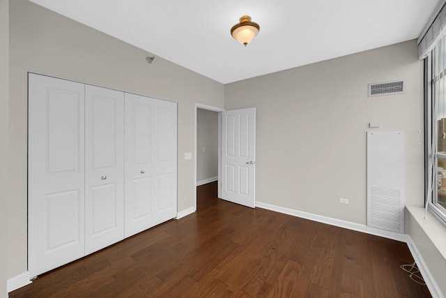 1600 S Prairie Ave Unit 1507, Chicago, IL 60616 - unfurnished bedroom featuring dark wood-type flooring and a closet