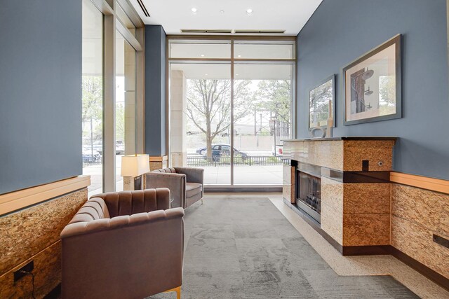 1600 S Prairie Ave Unit 1507, Chicago, IL 60616 - carpeted living room with expansive windows and a high end fireplace