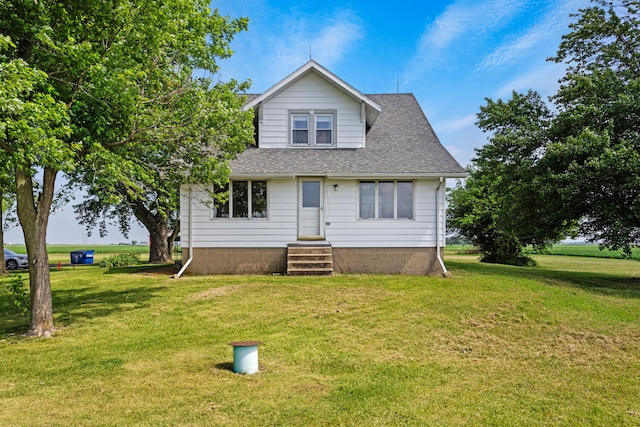 2070 County Road 2400, Thomasboro, IL 61878 - bungalow-style home featuring a front yard, a shingled roof, and entry steps