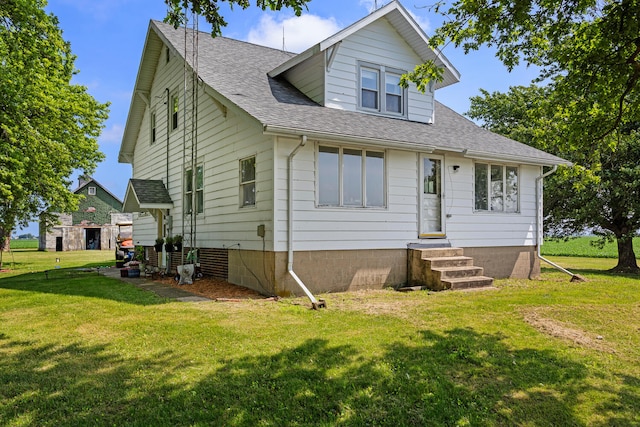 2070 County Road 2400, Thomasboro, IL 61878 - view of front of property featuring entry steps, a front yard, and a shingled roof