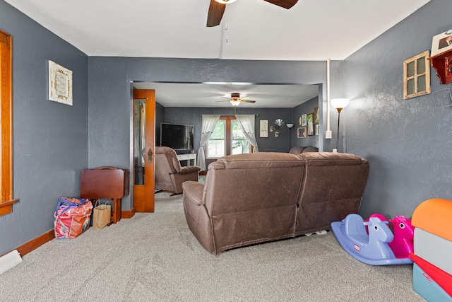 2070 County Road 2400, Thomasboro, IL 61878 - carpeted living room featuring a ceiling fan and a textured wall
