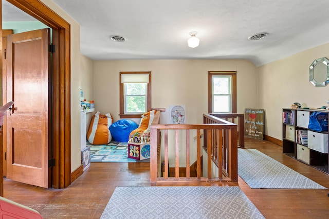 2070 County Road 2400, Thomasboro, IL 61878 - bedroom with hardwood / wood-style flooring and multiple windows