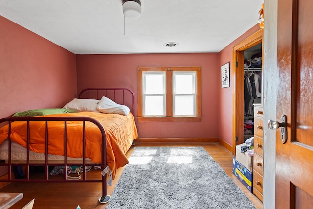 2070 County Road 2400, Thomasboro, IL 61878 - bedroom featuring wood finished floors and baseboards