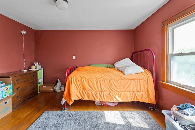 2070 County Road 2400, Thomasboro, IL 61878 - bedroom featuring multiple windows and wood finished floors