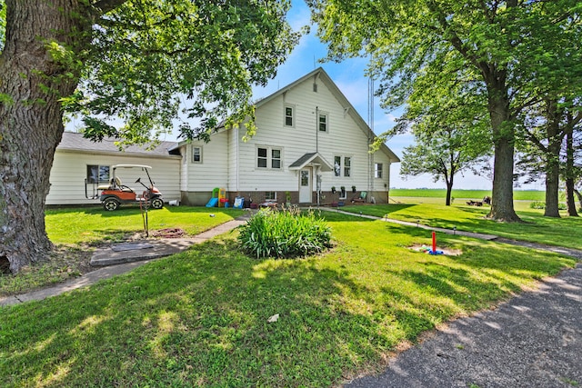 2070 County Road 2400, Thomasboro, IL 61878 - rear view of property with a lawn