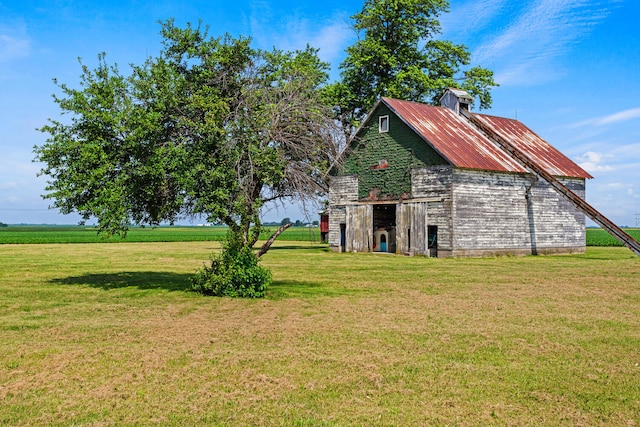 2070 County Road 2400, Thomasboro, IL 61878 - view of grassy yard with a barn and an outbuilding