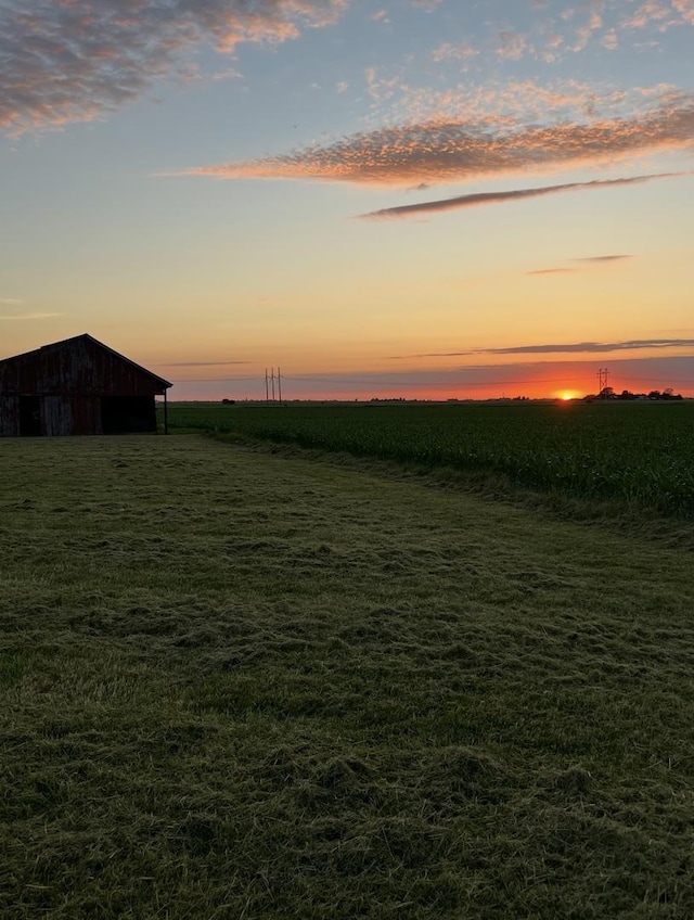2070 County Road 2400, Thomasboro, IL 61878 - yard at dusk featuring a view of countryside and an outbuilding