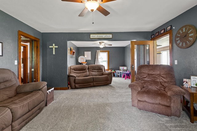 2070 County Road 2400, Thomasboro, IL 61878 - living room featuring a textured wall, ceiling fan, and carpet