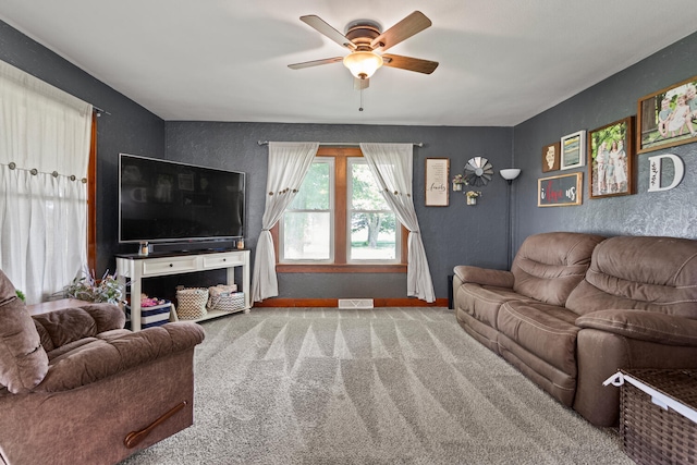 2070 County Road 2400, Thomasboro, IL 61878 - carpeted living area featuring ceiling fan and baseboards