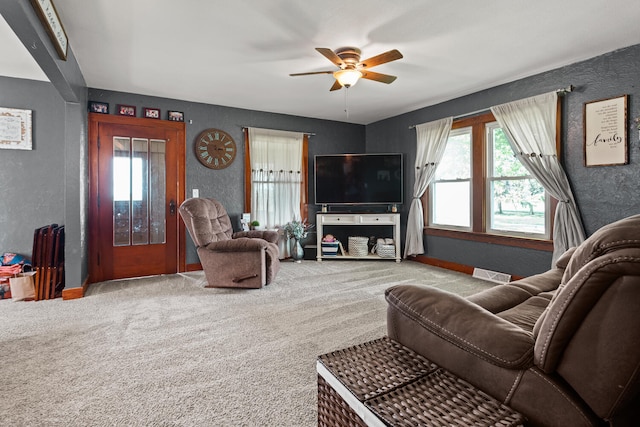 2070 County Road 2400, Thomasboro, IL 61878 - carpeted living room with a ceiling fan and a textured wall