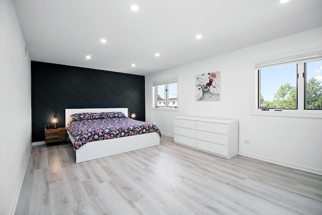15705 Lake Hills Ct Unit 2N, Orland Park, IL 60462 - bedroom with recessed lighting, wood finished floors, and an accent wall