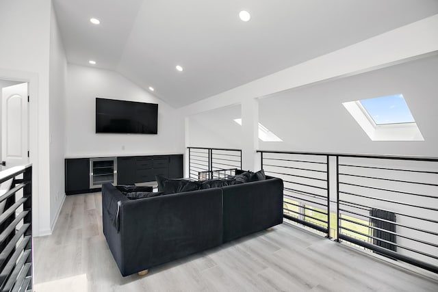 15705 Lake Hills Ct Unit 2N, Orland Park, IL 60462 - living room with a skylight, lofted ceiling, plenty of natural light, light wood finished floors, and recessed lighting