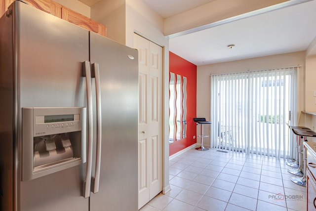911 Waterford Ln, Elk Grove Village, IL 60007 - kitchen with stainless steel refrigerator with ice dispenser and light tile patterned flooring