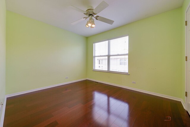 911 Waterford Ln, Elk Grove Village, IL 60007 - empty room with dark wood-style floors and ceiling fan