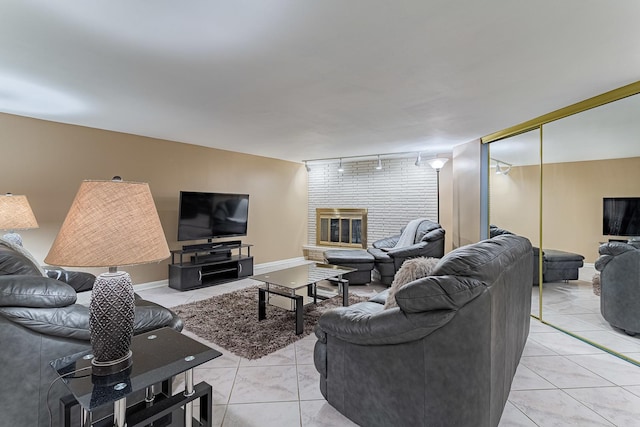711 E Greenview Rd, Itasca, IL 60143 - living area featuring track lighting, a brick fireplace, and light tile patterned floors