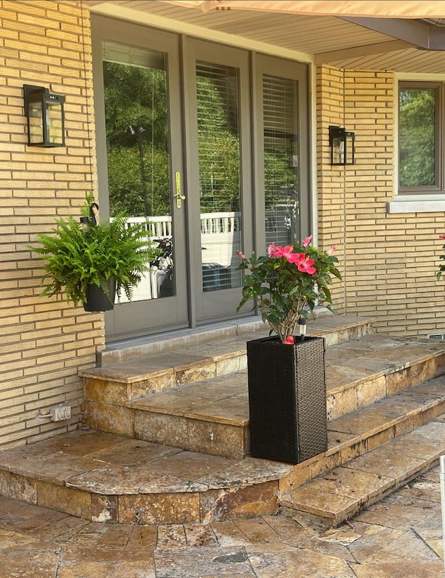 711 E Greenview Rd, Itasca, IL 60143 - view of exterior entry featuring brick siding and a porch