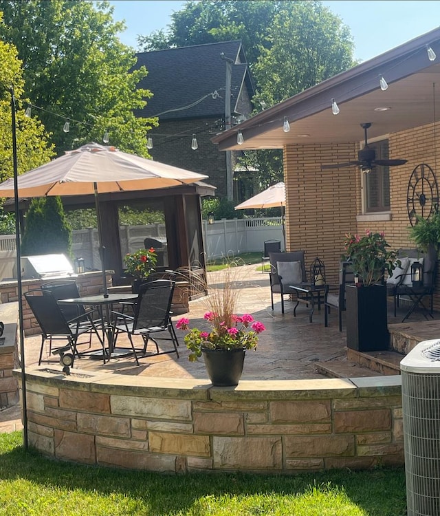 711 E Greenview Rd, Itasca, IL 60143 - view of patio / terrace with a ceiling fan, a gazebo, and outdoor dining space