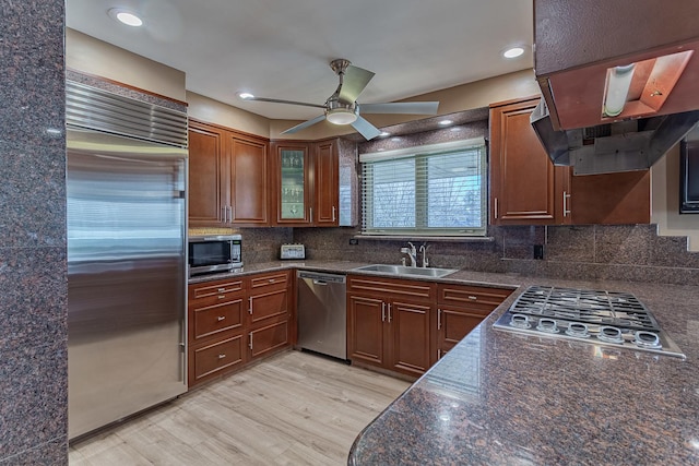 711 E Greenview Rd, Itasca, IL 60143 - kitchen with appliances with stainless steel finishes, dark countertops, range hood, and recessed lighting