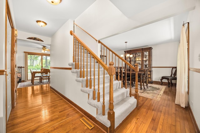 13542 S Erin Dr, Homer Glen, IL 60491 - stairs with a chandelier, hardwood / wood-style floors, and ceiling fan