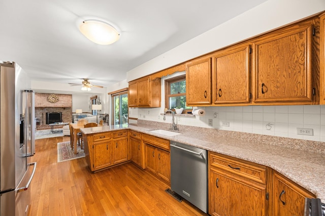 13542 S Erin Dr, Homer Glen, IL 60491 - kitchen featuring stainless steel appliances, a peninsula, light countertops, and wood finished floors