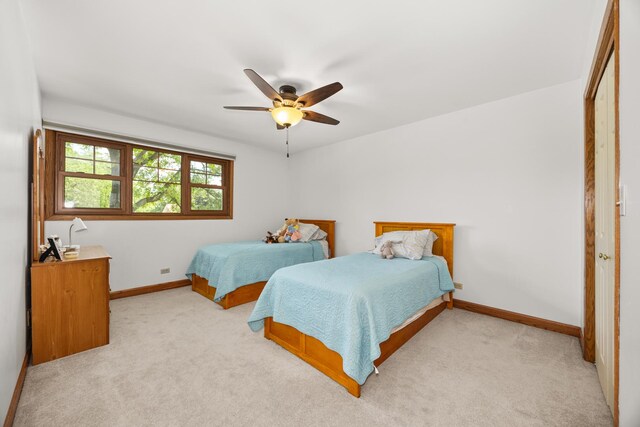 13542 S Erin Dr, Homer Glen, IL 60491 - bedroom featuring light colored carpet, a closet, and ceiling fan