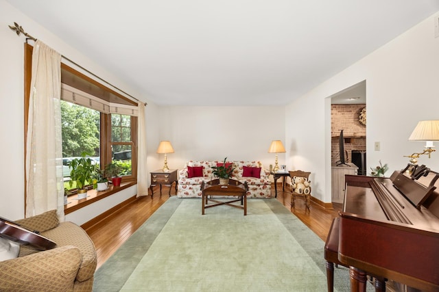 13542 S Erin Dr, Homer Glen, IL 60491 - living area with wood finished floors and a brick fireplace