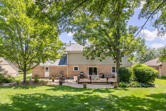13542 S Erin Dr, Homer Glen, IL 60491 - rear view of house featuring a deck, a yard, brick siding, and a patio area