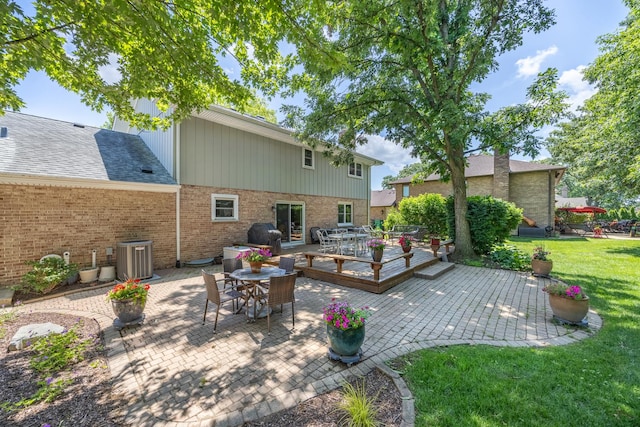 13542 S Erin Dr, Homer Glen, IL 60491 - rear view of house featuring a patio, a wooden deck, outdoor dining area, a yard, and brick siding