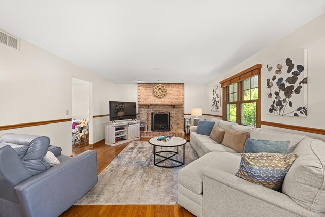13542 S Erin Dr, Homer Glen, IL 60491 - living area featuring wood finished floors and a brick fireplace
