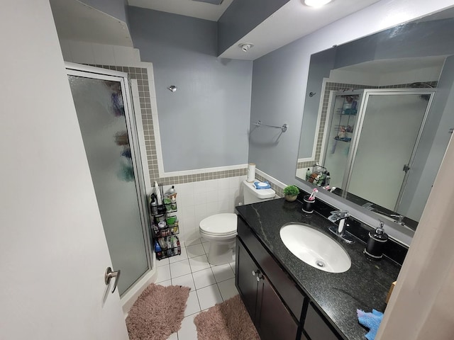 310 Partridge Ln, Wheeling, IL 60090 - full bathroom with tile patterned flooring, tile walls, a shower stall, vanity, and wainscoting