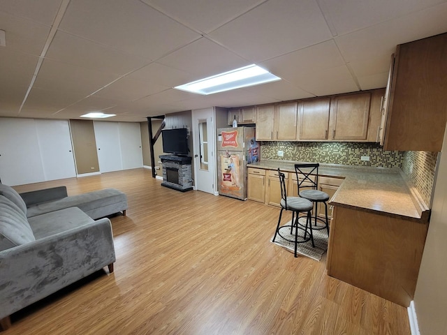 310 Partridge Ln, Wheeling, IL 60090 - kitchen with freestanding refrigerator, light wood finished floors, decorative backsplash, a drop ceiling, and open floor plan
