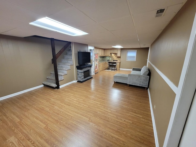 310 Partridge Ln, Wheeling, IL 60090 - living area featuring light wood-style flooring, a fireplace, and stairway