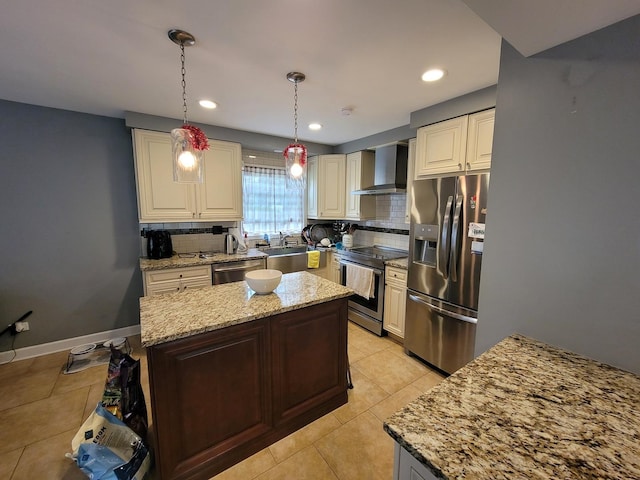 310 Partridge Ln, Wheeling, IL 60090 - kitchen with appliances with stainless steel finishes, wall chimney exhaust hood, tasteful backsplash, a kitchen island, and recessed lighting