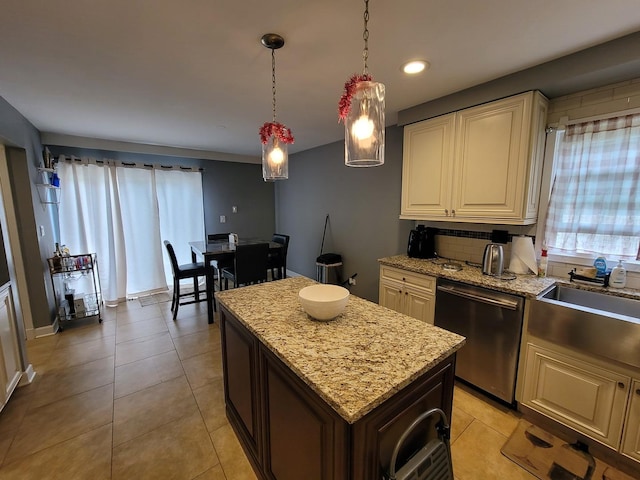 310 Partridge Ln, Wheeling, IL 60090 - kitchen with dishwasher, light stone countertops, a center island, pendant lighting, and light tile patterned flooring