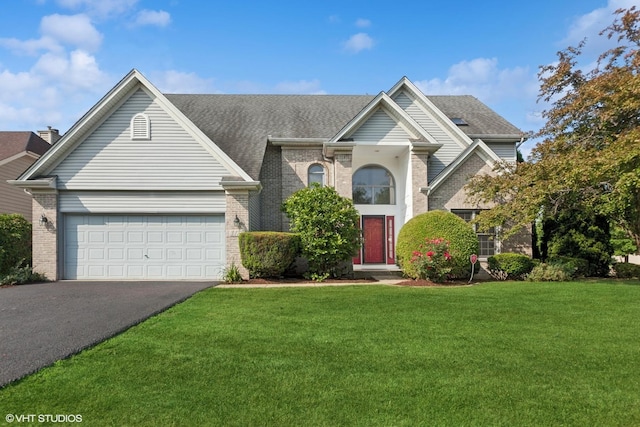3175 Wild Meadow Ln, Aurora, IL 60504 - traditional-style house with driveway, brick siding, a garage, and a front lawn