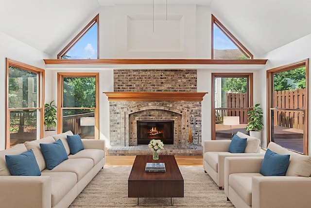 3175 Wild Meadow Ln, Aurora, IL 60504 - living area with high vaulted ceiling, a fireplace, and wood finished floors