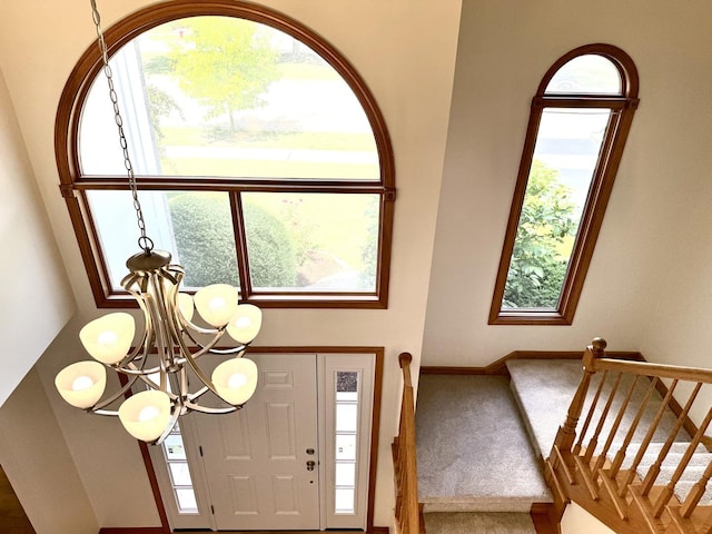 3175 Wild Meadow Ln, Aurora, IL 60504 - carpeted foyer entrance with a chandelier and stairway