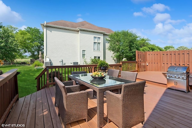 3175 Wild Meadow Ln, Aurora, IL 60504 - deck with outdoor dining area, a yard, and area for grilling