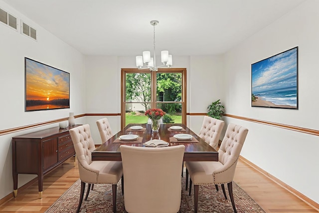 3175 Wild Meadow Ln, Aurora, IL 60504 - dining space with light wood-type flooring and a chandelier