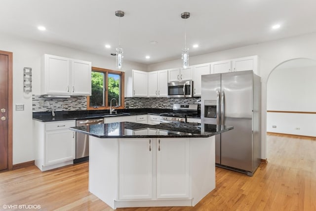 3175 Wild Meadow Ln, Aurora, IL 60504 - kitchen featuring appliances with stainless steel finishes, decorative backsplash, white cabinets, light wood-style floors, and recessed lighting