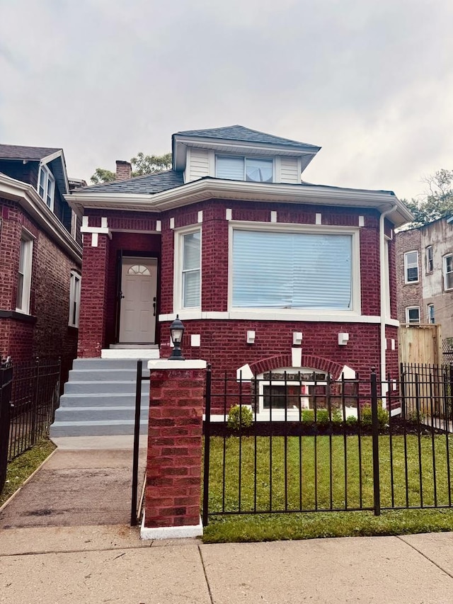 7253 S Marshfield Ave, Chicago, IL 60636 - view of front facade featuring a fenced front yard, brick siding, and a chimney