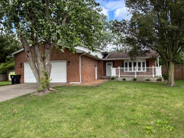 1038 Ruth Crane Dr, Rantoul, IL 61866 - ranch-style home featuring brick siding, an attached garage, concrete driveway, and covered porch
