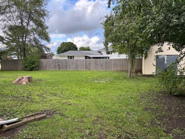 1038 Ruth Crane Dr, Rantoul, IL 61866 - view of yard featuring a storage unit