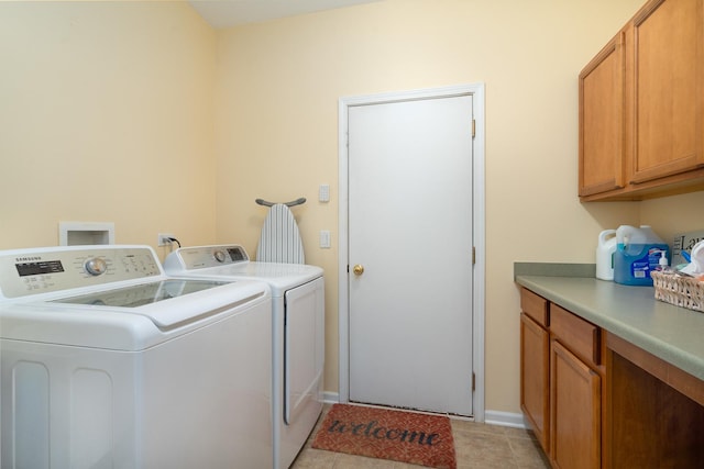 17857 Wilker Dr, Lockport, IL 60441 - laundry area featuring separate washer and dryer, cabinet space, and light tile patterned floors