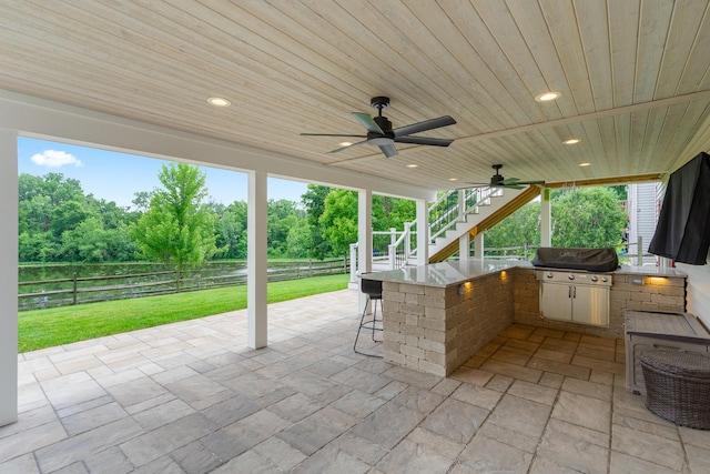 17857 Wilker Dr, Lockport, IL 60441 - fenced backyard featuring an outdoor bar, stairs, a patio, view of scattered trees, and ceiling fan