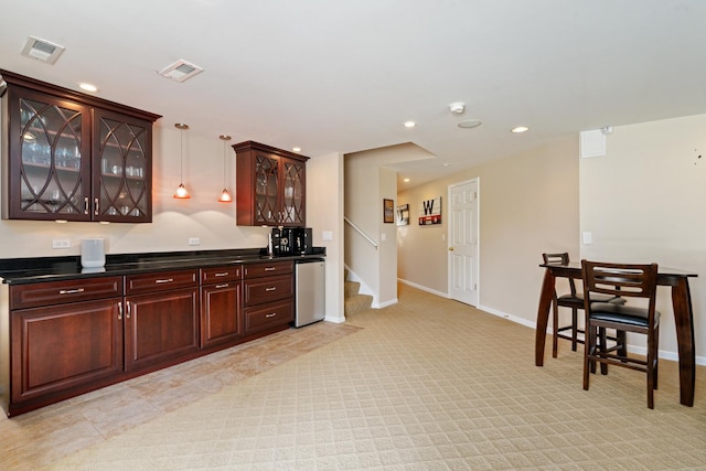 17857 Wilker Dr, Lockport, IL 60441 - kitchen with refrigerator, recessed lighting, light colored carpet, dark countertops, and glass insert cabinets