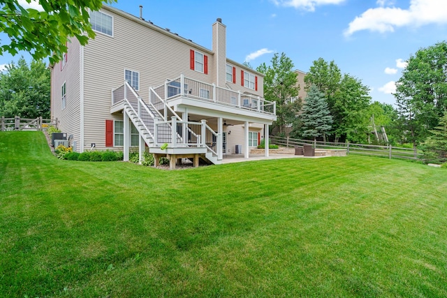 17857 Wilker Dr, Lockport, IL 60441 - rear view of house featuring a patio area, stairway, a chimney, a deck, and a garden