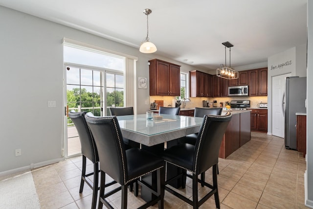 17857 Wilker Dr, Lockport, IL 60441 - dining room featuring light tile patterned flooring and baseboards
